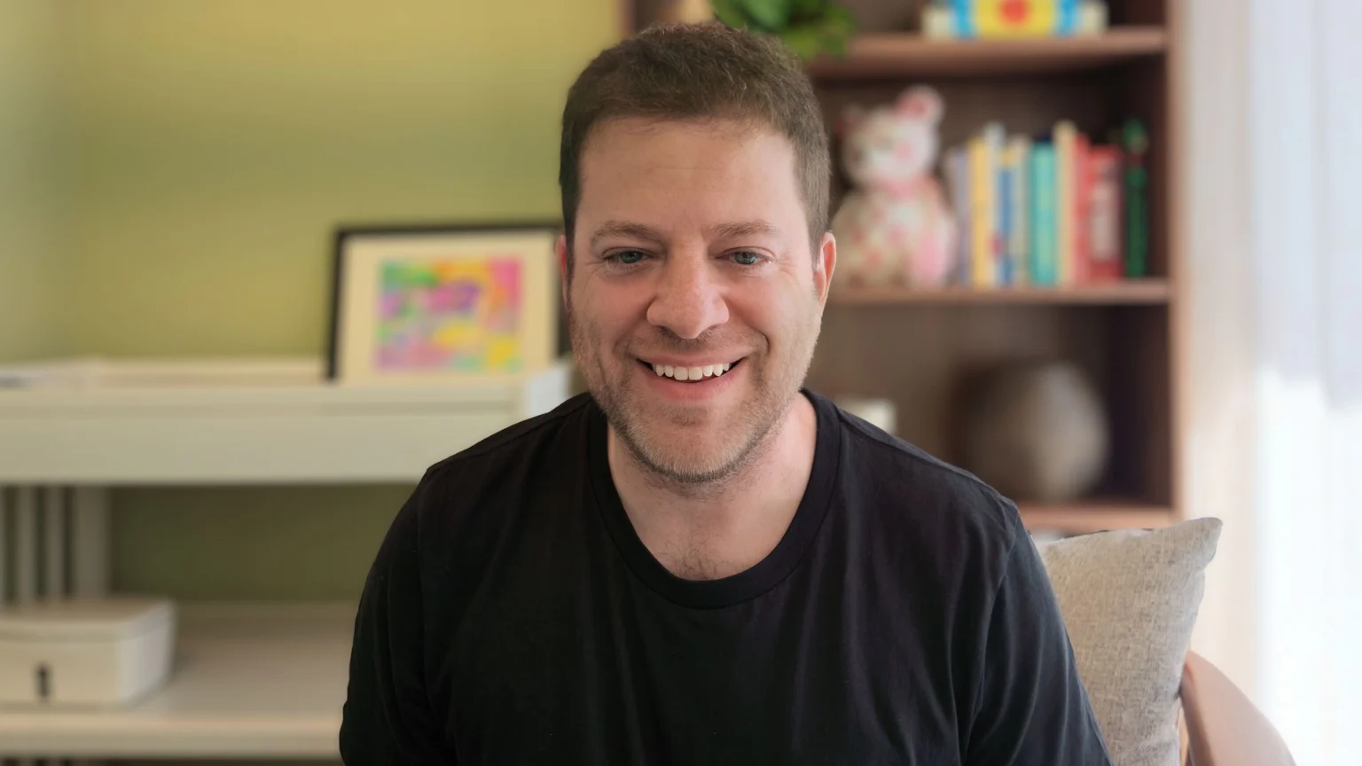Harlan Landes smiling at home